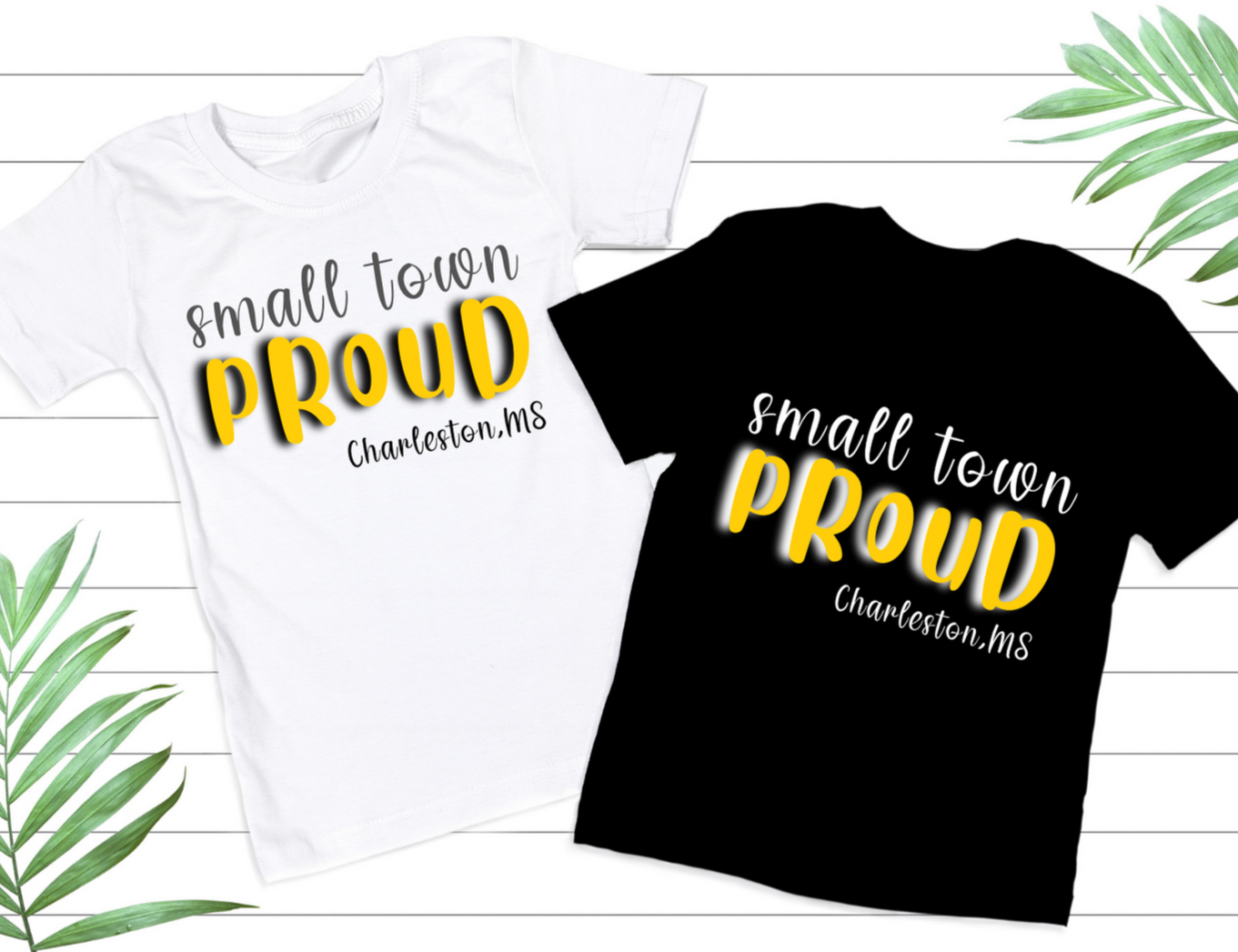 White t-shirt with black and gold writing.